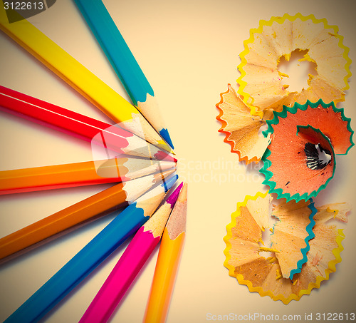 Image of seven colored pencils and shavings