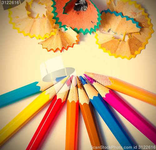 Image of pencils and shavings on white background