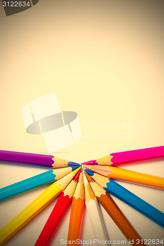 Image of varicolored pencils on white background
