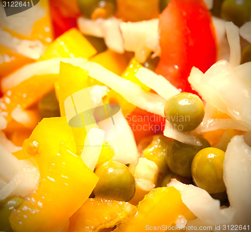 Image of salad with bell peppers, cabbage, tomatoes and green peas