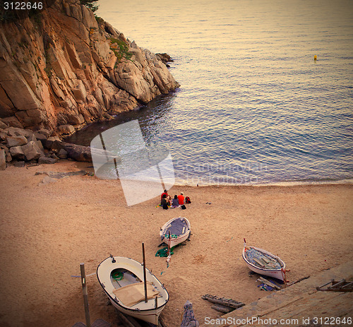 Image of Tossa de Mar, Catalonia, a quiet evening on the beach with white