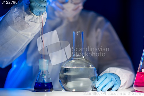 Image of close up of scientist making test in lab