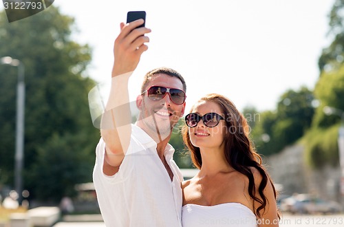 Image of smiling couple in city