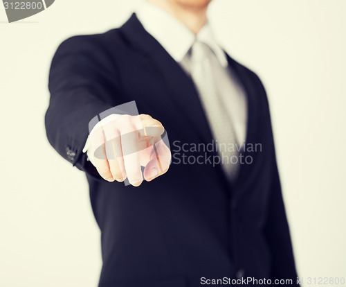 Image of man pointing his finger at you