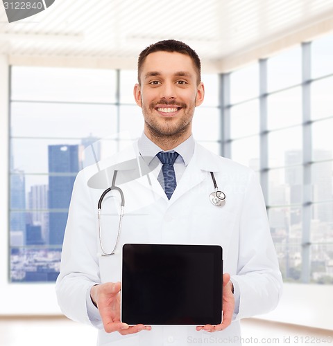 Image of smiling male doctor with tablet pc
