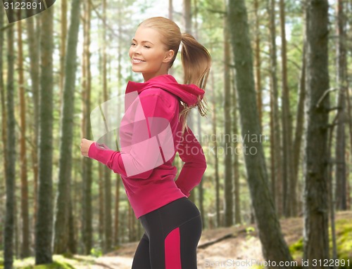 Image of happy woman running or jogging