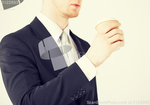 Image of man hand holding take away coffee