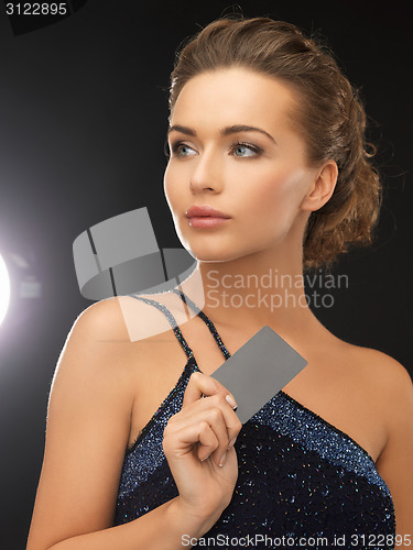 Image of woman in evening dress with plastic card