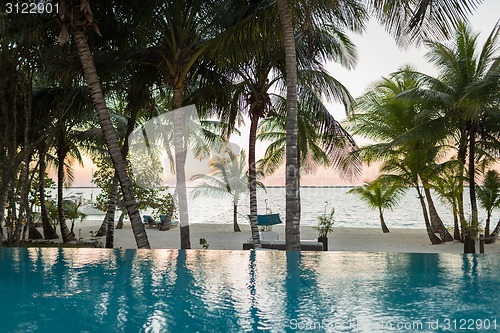 Image of swimming pool on tropical beach