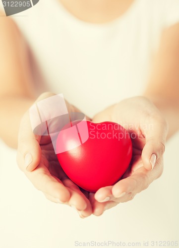 Image of woman hands with heart