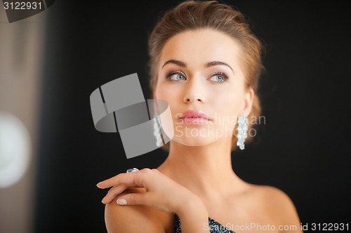 Image of woman with diamond earrings