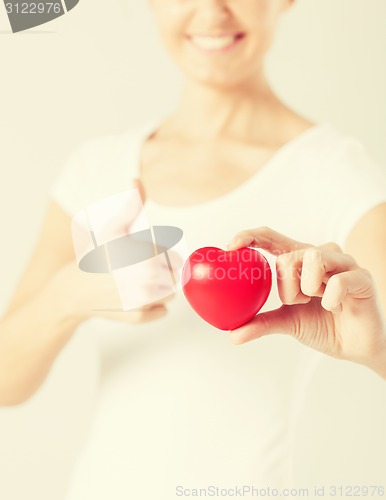 Image of woman hands with heart