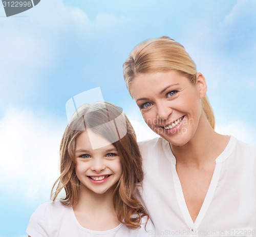 Image of smiling mother and little girl