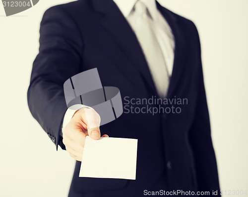 Image of man hand with blank paper