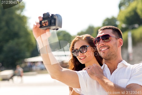 Image of smiling couple in city