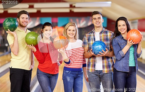 Image of happy friends in bowling club