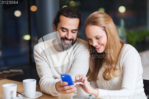 Image of happy couple with tablet pc and coffee at cafe