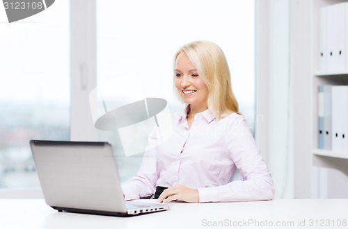 Image of smiling businesswoman or student with laptop