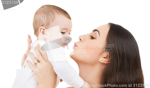 Image of mother kissing her baby