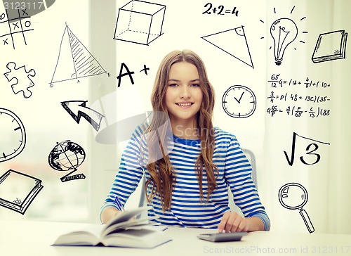 Image of student girl with book, notebook and calculator