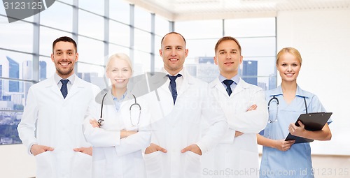 Image of group of smiling doctors with clipboard