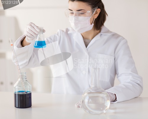 Image of close up of scientist making test in lab