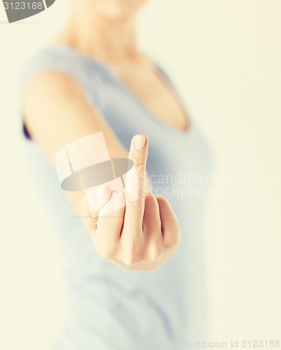Image of woman showing middle finger