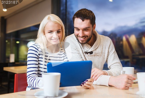 Image of happy couple with tablet pc and coffee at cafe