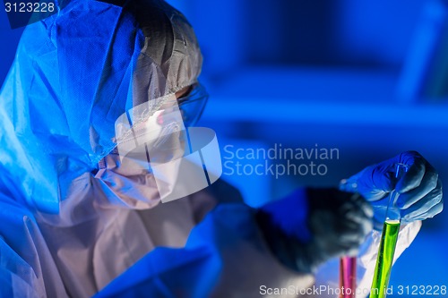 Image of close up of scientist making test in laboratory