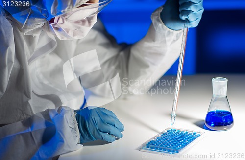 Image of close up of scientist making test in lab