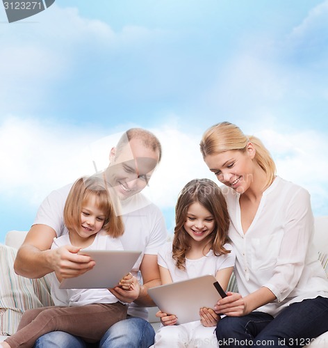 Image of happy family with tablet pc computers