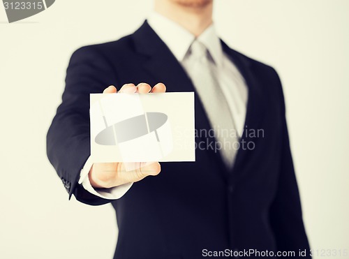 Image of man hand with blank paper