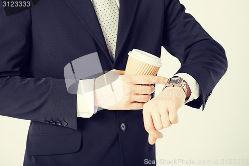 Image of man looking at wristwatch