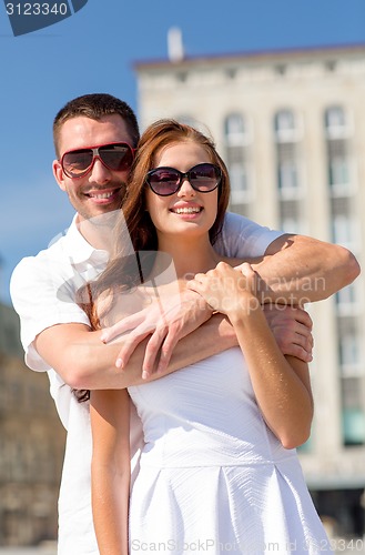 Image of smiling couple in city