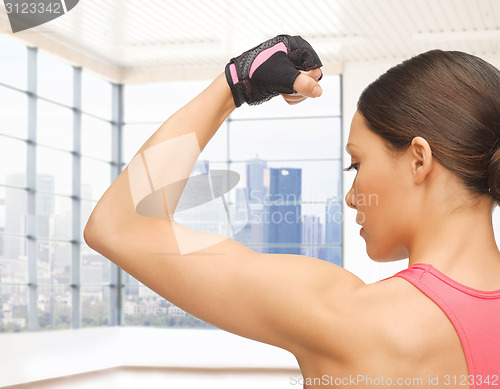 Image of close up of sporty woman flexing her bicep