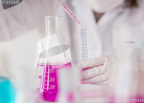 Image of close up of scientist making test in lab