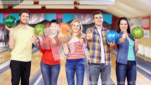 Image of happy friends in bowling club