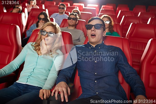 Image of friends watching horror movie in 3d theater