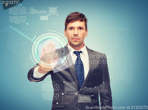 Image of attractive buisnessman working with virtual screen