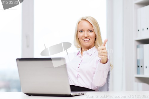 Image of smiling businesswoman or student with laptop