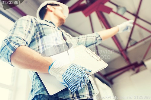 Image of man with blueprint