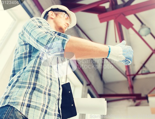 Image of man with blueprint