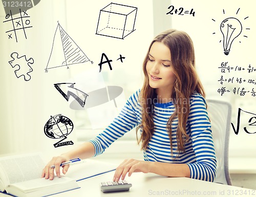 Image of student girl with book, notebook and calculator