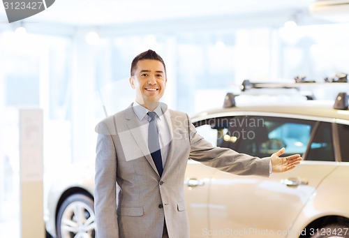 Image of happy man at auto show or car salon