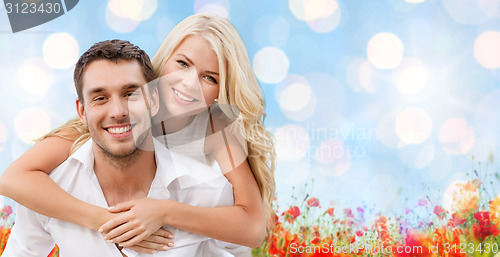 Image of happy couple having fun over natural background