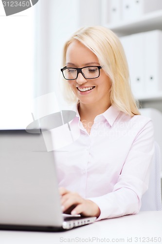 Image of smiling businesswoman or student with laptop