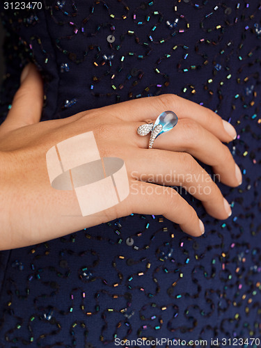 Image of beautiful woman with cocktail ring