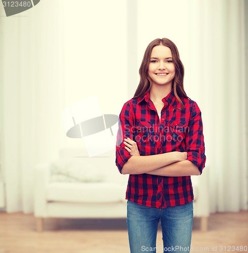 Image of smiling young woman in casual clothes