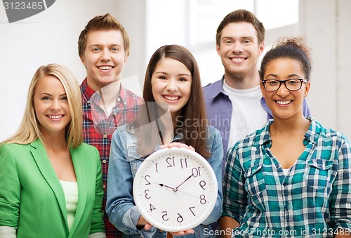 Image of group of students at school with clock