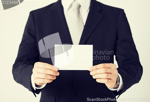 Image of man hand with blank paper